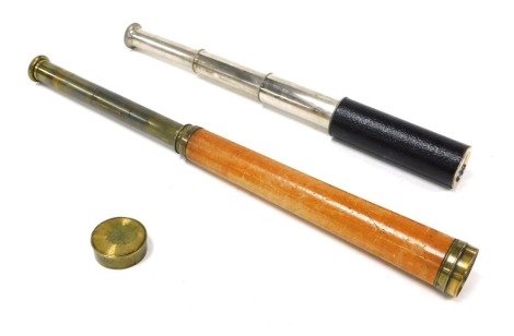 An early 20thC Pilot three draw telescope, bound in black leatherette, 36cm long extended, and a wooden bound brass telescope, single draw, 44cm long. (2)