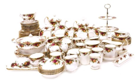 A Royal Albert porcelain Old Country Roses pattern part dinner, tea and coffee service, including a vegetable tureen and cover, large and small fruit bowls, three tier cake stand, sandwich plates, dinner, dessert and side plates, cereal bowls, tea pots, c