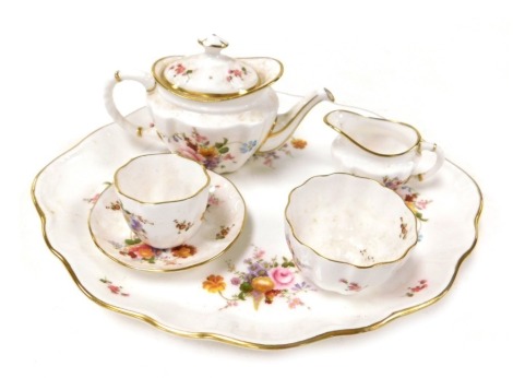 A Royal Crown Derby porcelain Derby Posies pattern miniature solitaire set, comprising a tray, teapot, cream jug, sugar bowl, teacup and saucer.