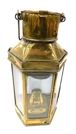 An early 20thC brass ship's storm lantern, by Eli Griffiths and Sons 1910, with burner and key, 40.5cm high.