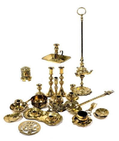 A group of 19thC and later brass ware, including candlesticks, Italian oil lamp, string box, candle scissors with tray, and a toasting fork. (qty)