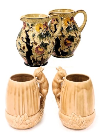 A pair of H J Wood Indian Tree pattern water jugs, 20cm high, together with a pair of sylvac brown glaze squirrel jugs, number 4068, impressed marks, 19.5cm high. (4)