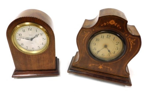 An early 20thC Smiths mahogany cased mantel clock, silvered dial bearing Arabic numerals, eight day clockwork movement, with integral key, the case of domed form, raised on brass feet, 20cm high, and an Edwardian mahogany and inlaid mantel clock, with Swi