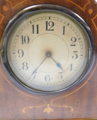 An early 20thC Smiths mahogany cased mantel clock, silvered dial bearing Arabic numerals, eight day clockwork movement, with integral key, the case of domed form, raised on brass feet, 20cm high, and an Edwardian mahogany and inlaid mantel clock, with Swi - 2