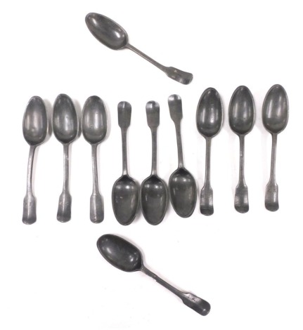 A group of Georgian pewter dessert spoons, with shell capped bowls, the handles initial engraved. (11)