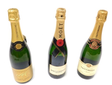 A bottle of Moet and Chandon Imperial champagne, bottle of Taittinger brut reserve champagne, and a bottle of Marie Henry brut vintage champagne 1999. (3)