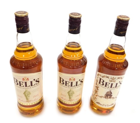 Three bottles of Bell's blended scotch whisky, fine aged, including a bottle with a limited edition design label. (3)