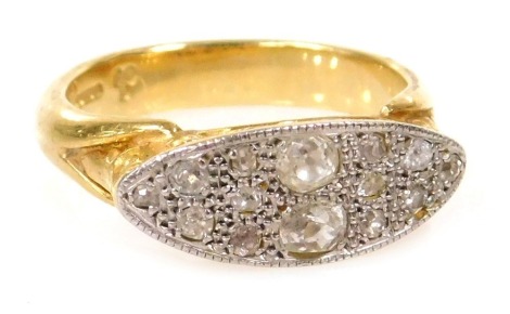 An 18ct gold and diamond cluster ring, in a channeled oblong design, high scroll set, approximately 0.5ct, size R, 6.9g.