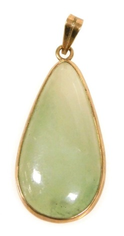 A 9ct gold and cabochon jade tear drop pendant, on a loop suspension, 6.4g all in.