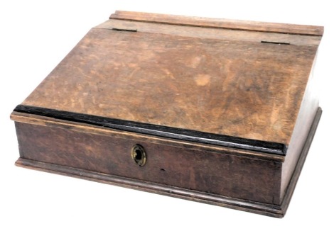 A Victorian oak table top clerk's desk, the hinged lid opening to reveal a vacant interior, with three suspended drawers, 21cm high, 52cm wide x 46cm deep.