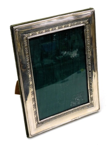 An Elizabeth II silver strut photograph frame, with Celtic knot decoration, London 2001, 22.5cm x 18cm.