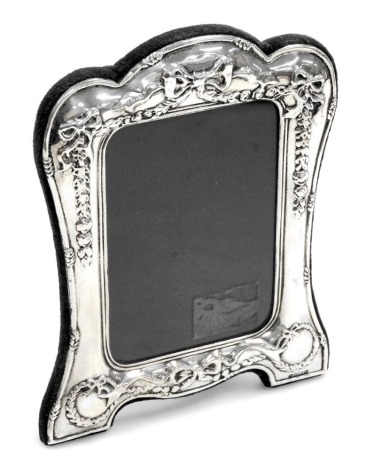 An Elizabeth II silver strut photograph frame, embossed with tied bows, swags and laurel wreaths, R Carr, Sheffield 1994, 20.5cm x 15.5cm.