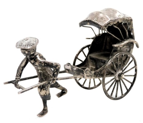 A late 19th/early 20thC Chinese silver model of a man pulling a rickshaw, marks for Luen Wo, 1.23oz.