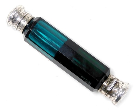 A Victorian turquoise and green glass double ended scent bottle, with a button operated hinged lid and a screw lid, white metal, with foliate engraving, shield reserves, one engraved Toppie, 13cm wide.