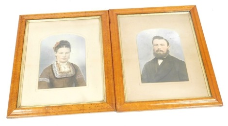 A pair of 19thC over painted photographs, portraits of a gentleman and lady, in a burr maple frame, 37.5cm x 28cm.