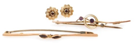 A pair of Edwardian 9ct gold and amethyst bar brooches, together with a pair of 9ct gold and garnet set stud earrings, 4.1g all in.