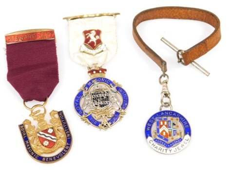 A silver gilt and enamel jewel for the Royal Masonic Institution for Girls, with badge for Kent, and Steward 1930, a silver West Lancashire charity jewel, and a metal and enamel jewel for the Royal Masonic Benevolent Institution. (3)