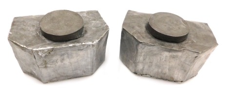 A pair of early 20thC Chinese pewter tea caddies, of canted rectangular form, with engrave floral and foliate decoration, 17cm wide. (AF)