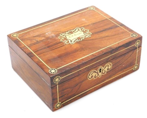 A Victorian rosewood and brass inlaid sewing box, with escutcheon to the lid named for M P Morris, the hinged lid opening to reveal a fitted interior, 9cm high, 23cm wide,17cm deep.