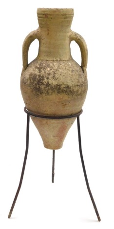 A Roman type pottery amphora in a cast iron frame, 67.5cm high.