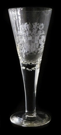 A German glass presentation goblet, of fluted form, engraved with a coat of arms, raised on a conical foot engraved "D.Graf zu Solms Wildenfels f/l I Frh.v.Hollen", 28cm high.