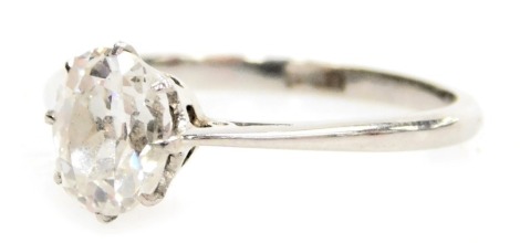 An early 20thC oval diamond and platinum solitaire ring, high claw set, approximately 0.9ct, size N, 2.7g.