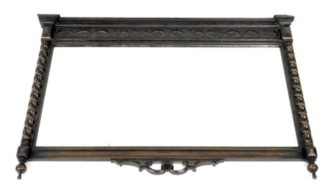 A 1920s oak wall mirror, inverted break front, moulded cornice above blind fret frieze and a bevelled plate, flanked by spirally turned pilasters, 71cm high, 100cm wide.