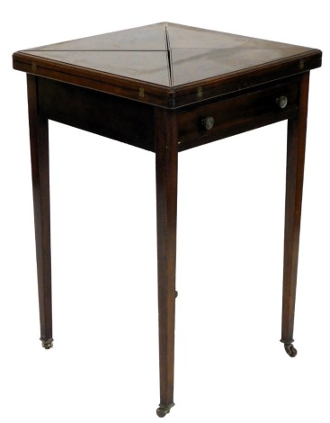 An Edwardian walnut envelope card table, square top with a green leather inset, above a frieze drawer, on square tapering legs with brass and ceramic castors, 78cm high, 51cm wide. (AF)