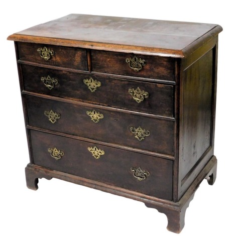 An 18thC oak chest of drawers, the rectangular top with a moulded edge above two short and three long drawers, each with later brass pierced handles, on bracket feet, 89cm high, 94cm wide.