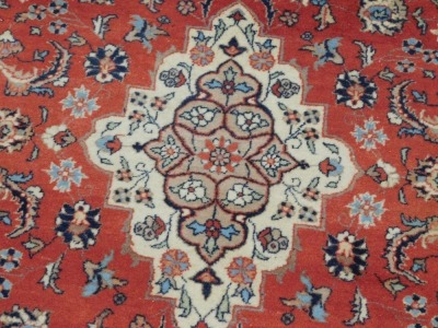 A Persian design rug, with central red ground gul, beige and grey borders, 195cm x 130cm. - 2