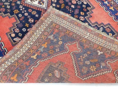 A Turkish design rug, with blue multi gul central field, on a red ground, 237cm x 159cm. - 3