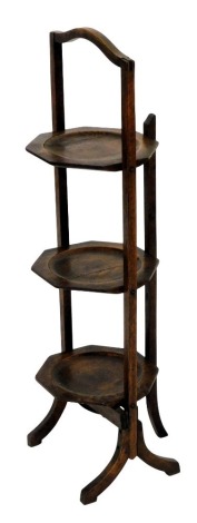 A 1920s oak folding cake stand.