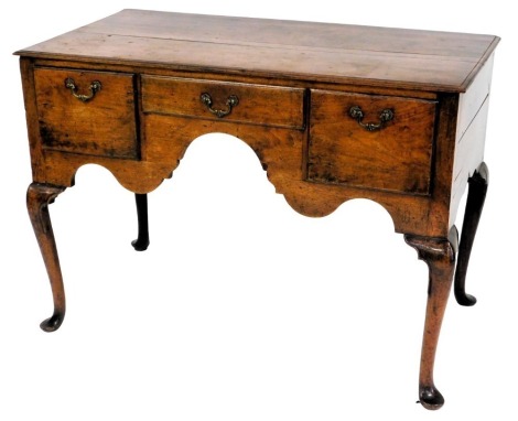 An 18thC oak low boy, with moulded top, three frieze drawers and cabriole legs with pad feet, 78cm high, 113cm wide, 58cm deep.