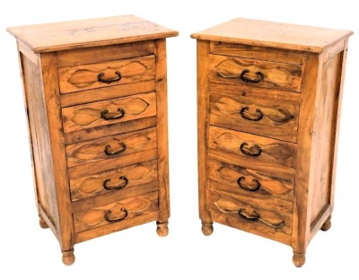 A pair of Eastern hardwood cabinets, each with a rectangular top and five drawers, on turned feet, 72cm high, 43cm wide.