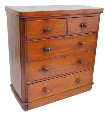 A Victorian mahogany chest of drawers, the top with rounded corners, above two short and three long drawers, with turned handles, on a plinth base, 109cm high, 100cm wide.