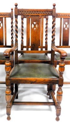 A set of six early 20thC oak dining chairs, with green leatherette drop in seats, raised on cup and cover supports, united by a H frame stretcher, comprising a pair of carvers and four single chairs. - 2