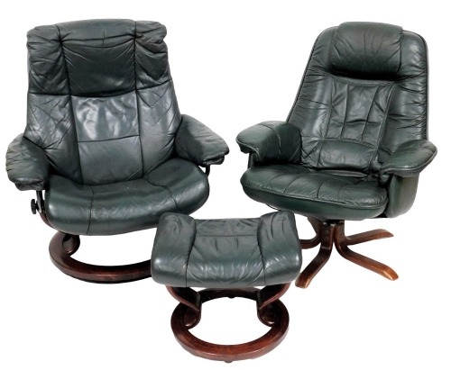 A pair of green leather upholstered swivel chairs, in Stressless style, with x shaped base, together with a stool.