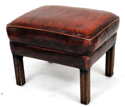 A oxblood red leather upholstered wing back Chesterfield armchair, in George III style with studded borders, on cabriole legs, an a similar stool. The upholstery in this lot does not comply with the 1988 (Fire & Fire Furnishing) Regulations, unless sold - 3