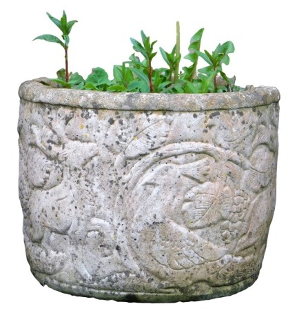 A reconstituted stone garden urn, cast with birds, leaves etc, 30cm high, 39cm diameter.