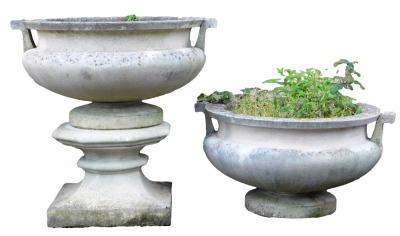 A pair of reconstituted stone two handled garden urns, one with plinth, each urn 36cm high, 63cm wide, plinth 27cm high.