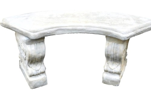 A concrete garden seat, with a curved top, raised on scroll ends, 102cm wide.