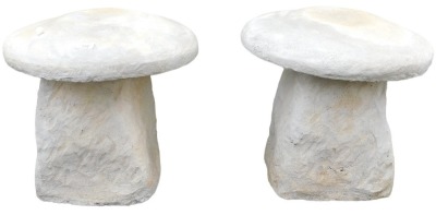 A pair of concrete staddle stones, 45cm wide.