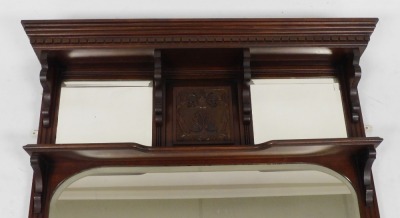 A Victorian mahogany over mantel mirror, the dentil moulded pediment over a pair of rectangular bevelled mirror plates flanking a carved panel, with a shaped shelf, over a larger rectangular plate, 94cm x 117cm. - 2