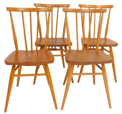 A set of four Ercol elm and beech dining chairs, model number 391, some bearing labels and each stamped to underside BS BE 1960 2056.