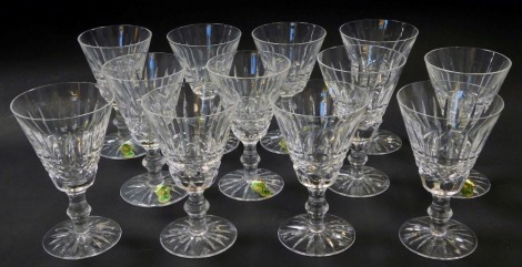 A set of twelve Waterford crystal Tramore pattern claret glasses, each 12.5cm high, some bearing paper labels, others stamped.