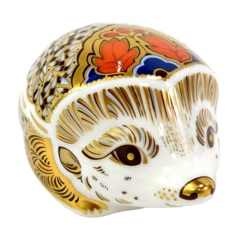 A Royal Crown Derby porcelain Hawthorne paperweight, red printed marks and gold stopper, 5cm high, boxed.