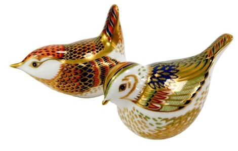 Two Royal Crown Derby porcelain bird paperweights, comprising Fire Crest, red printed marks and gold stopper, 5cm high, and Jenny Wren, red printed marks and gold stopper, 6.5cm high, both boxed.