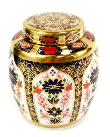 A Royal Crown Derby porcelain jar and cover, decorated in the Old Imari pattern, 1128, red printed marks, 12cm high, boxed.