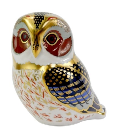 A Royal Crown Derby porcelain tawny owl paperweight, red printed marks and gold stopper, 9cm high, boxed.