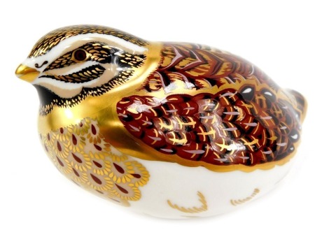 A Royal Crown Derby porcelain dappled quail paperweight, red printed marks and gold stopper, 6.5cm high, boxed.